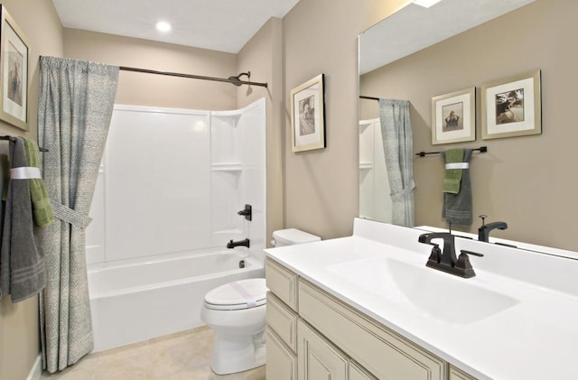 full bathroom featuring toilet, vanity, tile patterned floors, and  shower combination