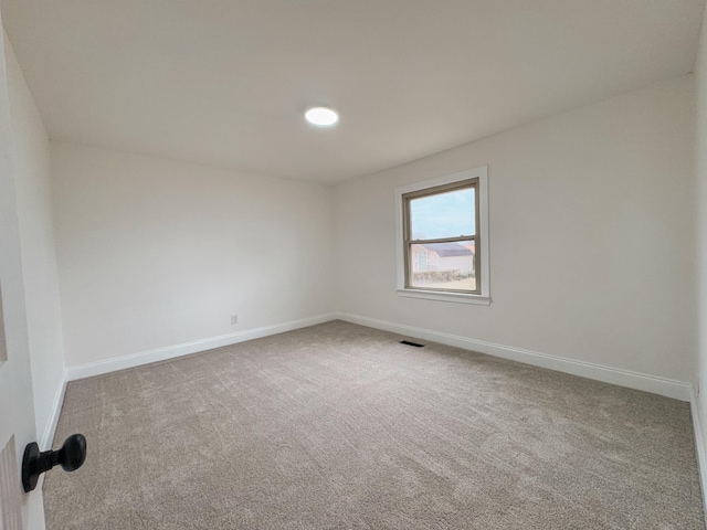 spare room with carpet floors