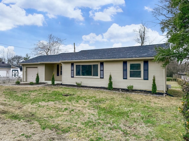 single story home with a garage and a front yard