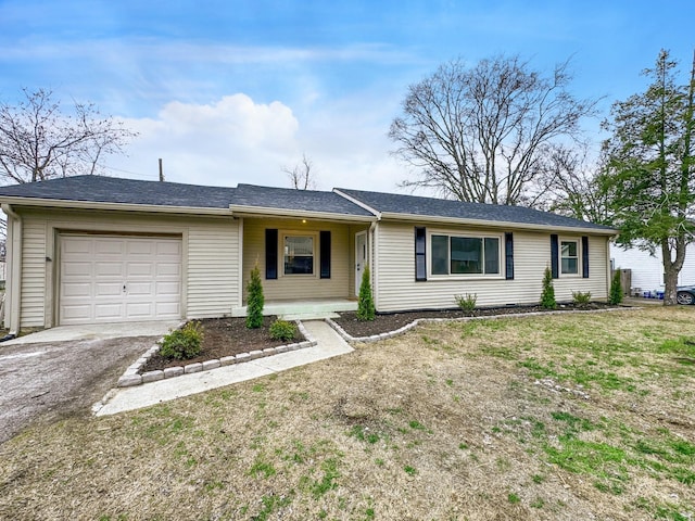 ranch-style home featuring a garage and a front yard