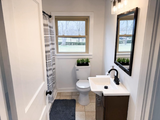 bathroom featuring tile patterned flooring, vanity, a shower with curtain, and toilet