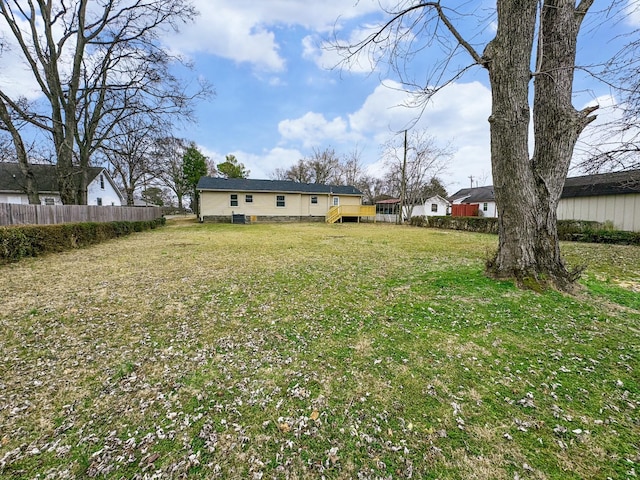 view of yard with a wooden deck