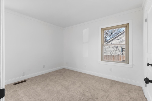 carpeted empty room with ornamental molding