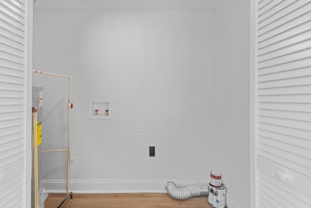 clothes washing area featuring hookup for an electric dryer, hookup for a washing machine, and hardwood / wood-style floors