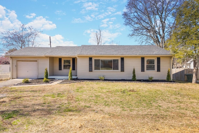 ranch-style home with a garage and a front yard