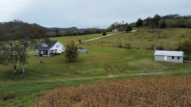 drone / aerial view with a mountain view and a rural view