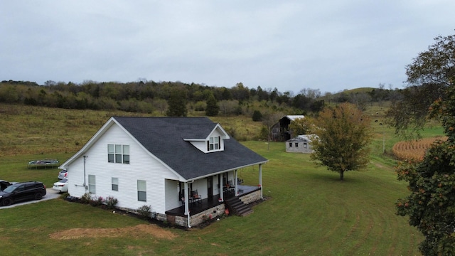 view of front of home featuring a front yard and covered porch