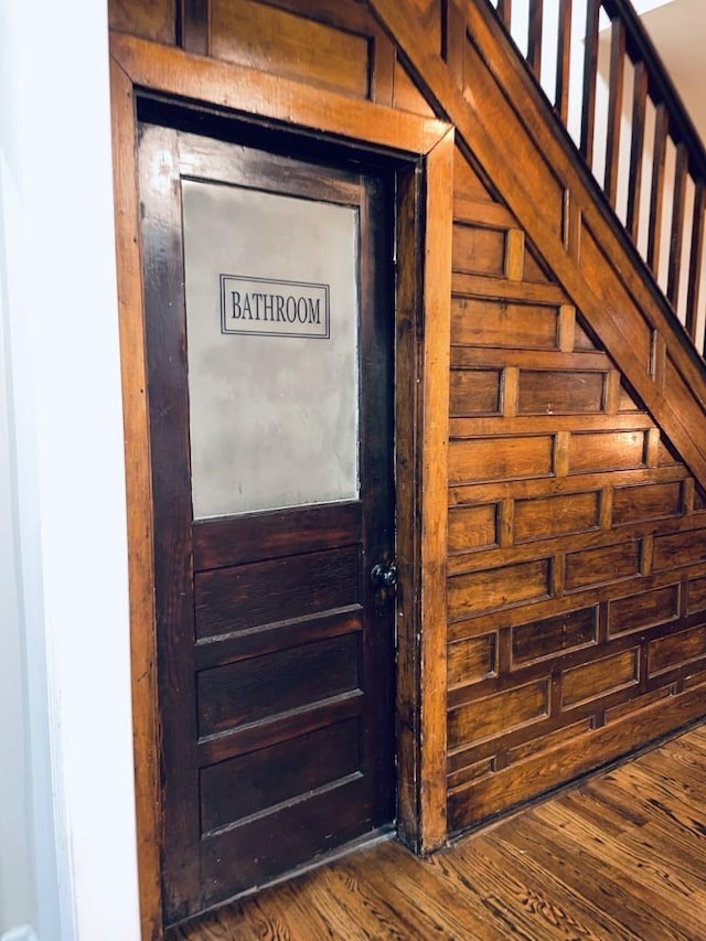 room details with wood-type flooring and wood walls