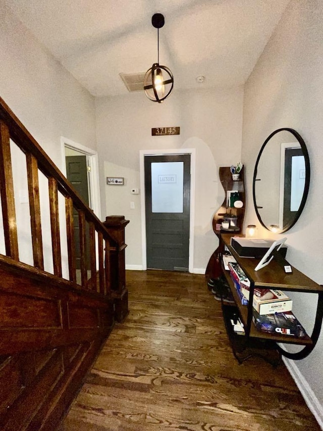 foyer entrance featuring dark wood-type flooring