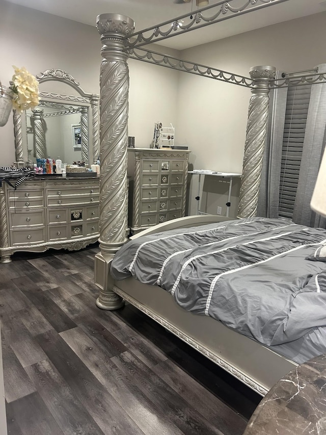 bedroom featuring dark hardwood / wood-style flooring