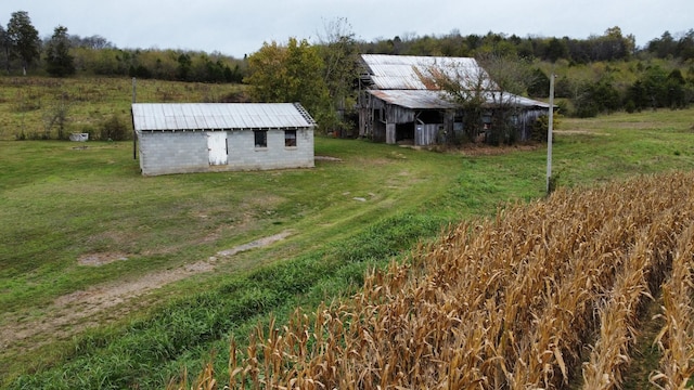 exterior space featuring an outbuilding and a rural view