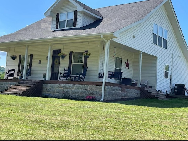 view of front facade with covered porch and a front yard