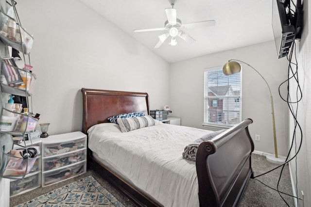 bedroom featuring lofted ceiling, carpet, and ceiling fan