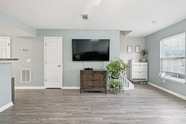 unfurnished living room with light wood-type flooring