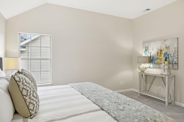 carpeted bedroom featuring vaulted ceiling