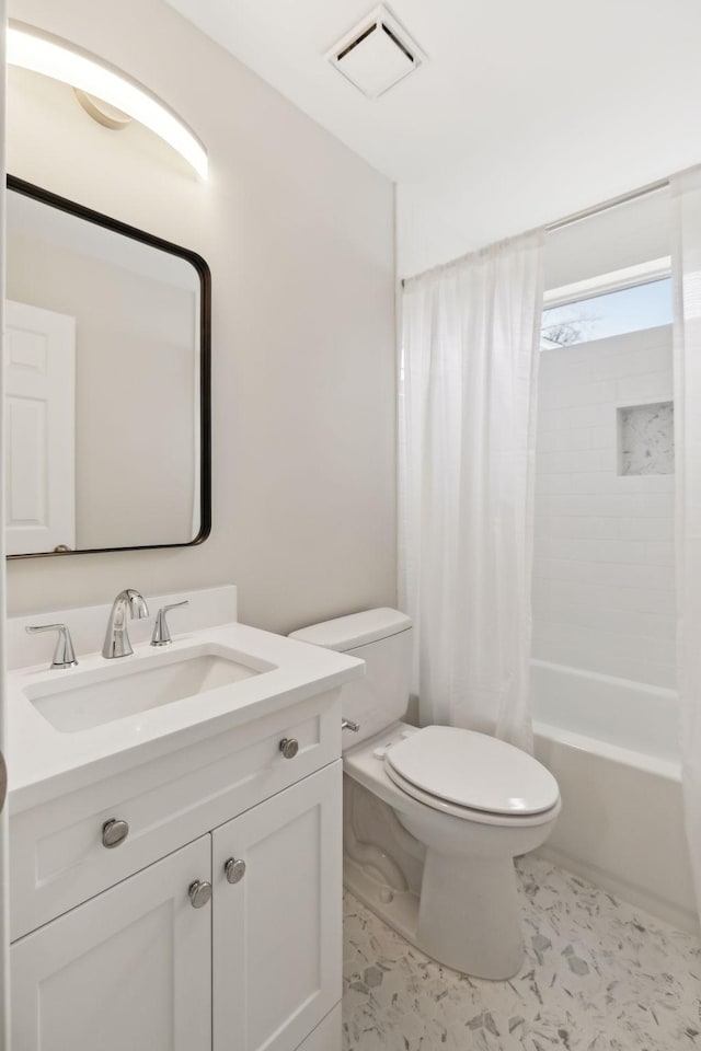 full bathroom with vanity, toilet, and shower / bath combo