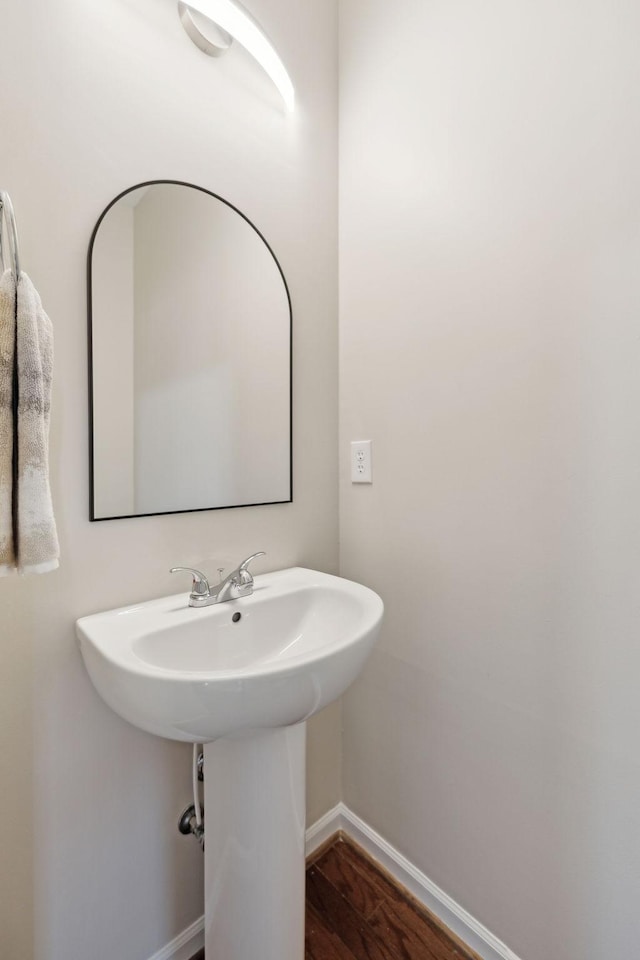 bathroom with hardwood / wood-style flooring