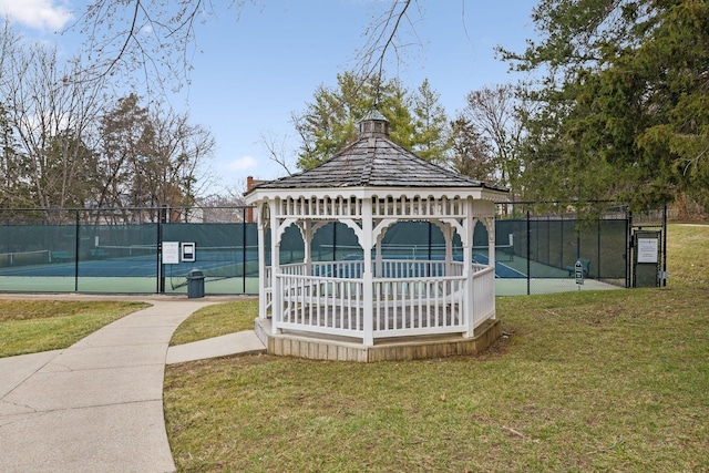 view of home's community featuring a yard, a gazebo, and tennis court