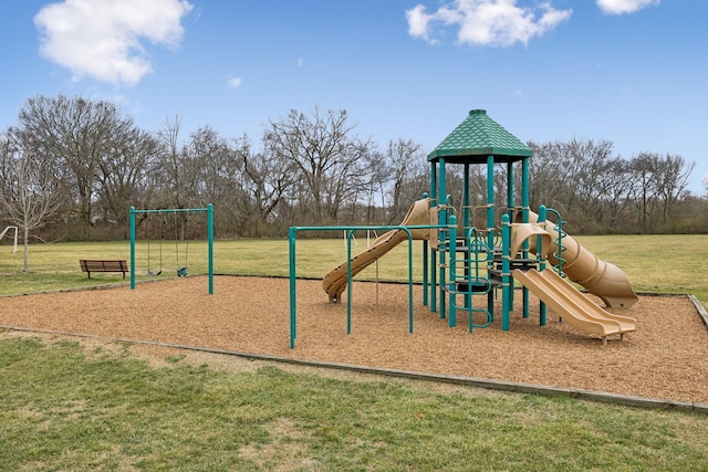 view of jungle gym featuring a lawn