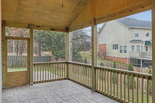 unfurnished sunroom with wood ceiling and lofted ceiling