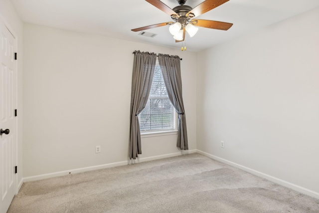 unfurnished room featuring ceiling fan and light carpet