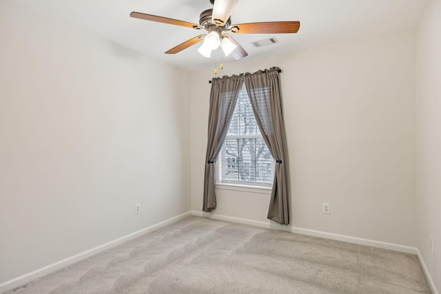 carpeted empty room with ceiling fan