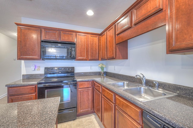 kitchen featuring sink, a textured ceiling, and black appliances