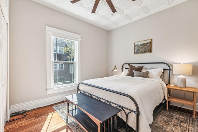 bedroom with wood-type flooring and ceiling fan