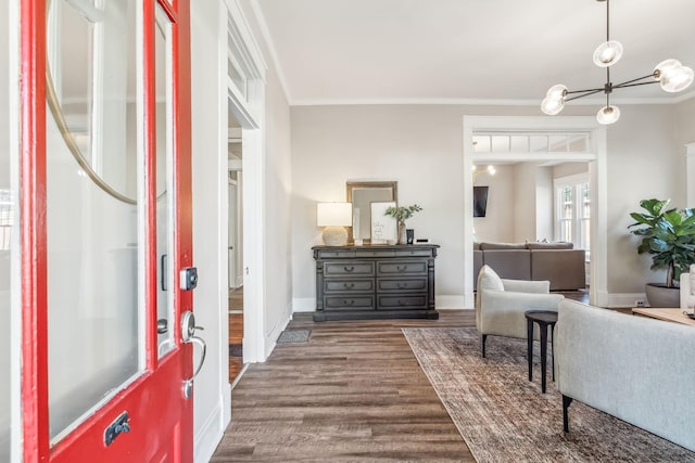 entryway with hardwood / wood-style flooring and ornamental molding