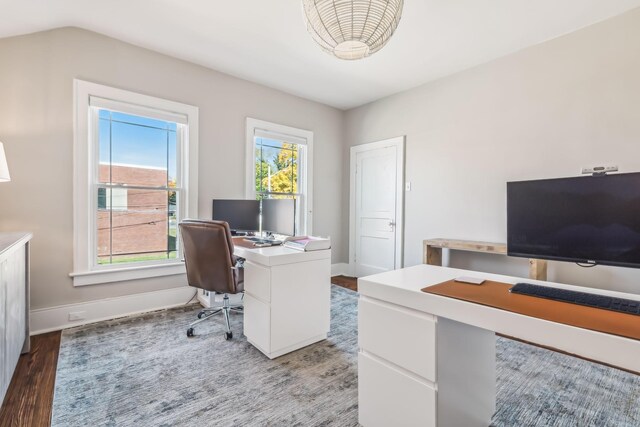 home office with dark wood-type flooring