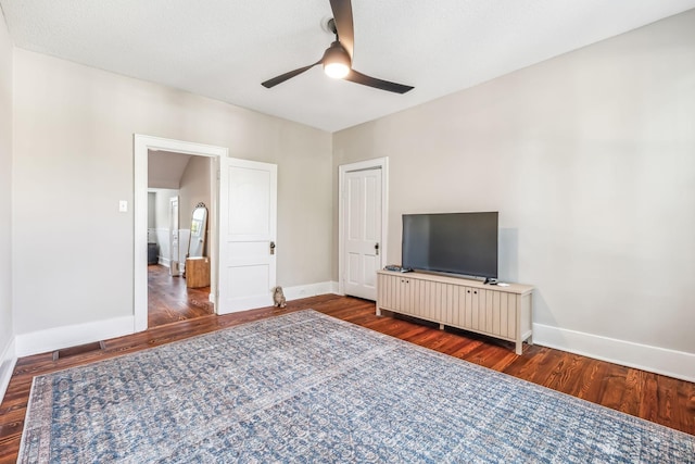 unfurnished bedroom with dark hardwood / wood-style floors and ceiling fan