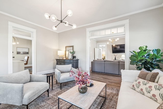 living room featuring crown molding and a chandelier