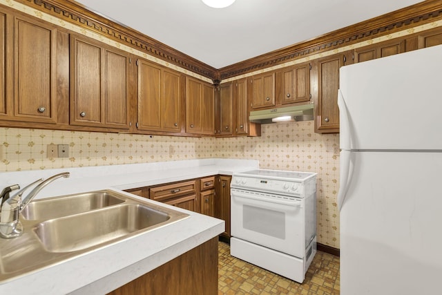 kitchen with sink, white appliances, and decorative backsplash