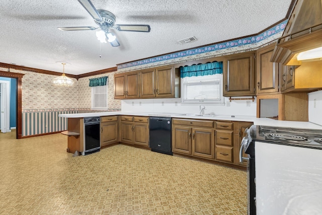 kitchen with pendant lighting, sink, dishwasher, electric range, and a textured ceiling