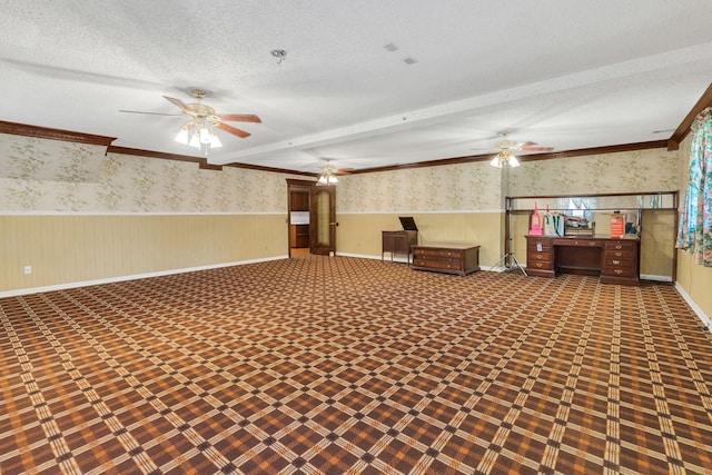 basement featuring ceiling fan, ornamental molding, and a textured ceiling