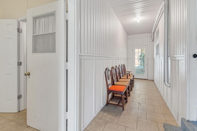 hall with light tile patterned floors