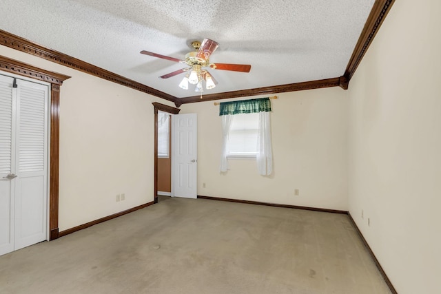 unfurnished bedroom with crown molding, light carpet, and a textured ceiling