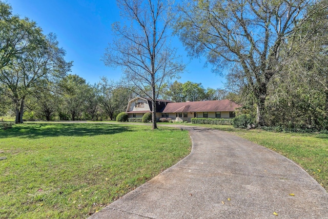 ranch-style house with a front lawn