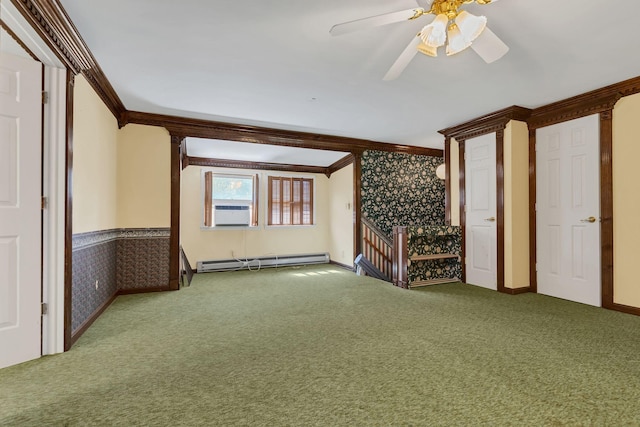 interior space with crown molding, a baseboard heating unit, cooling unit, and ceiling fan