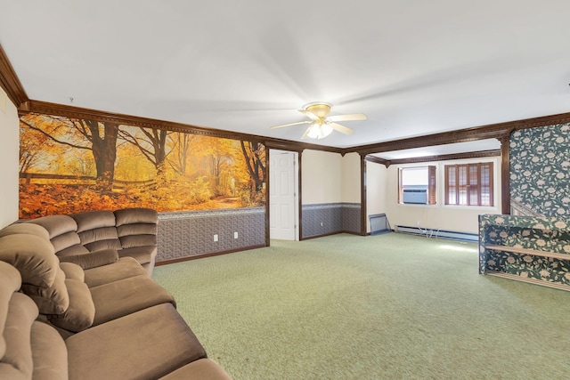 living room with a baseboard heating unit, crown molding, ceiling fan, and carpet flooring