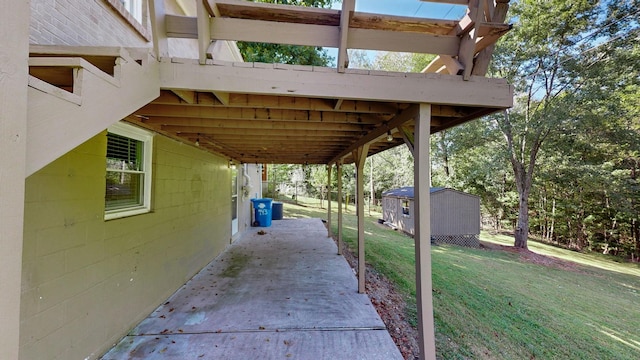 view of patio with a storage unit