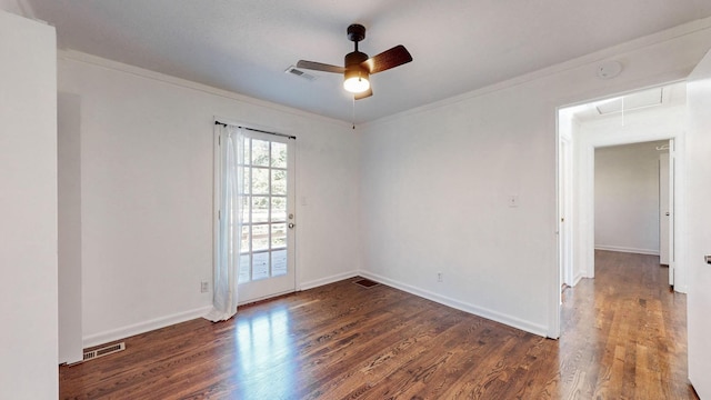 empty room with ornamental molding, ceiling fan, and dark hardwood / wood-style flooring