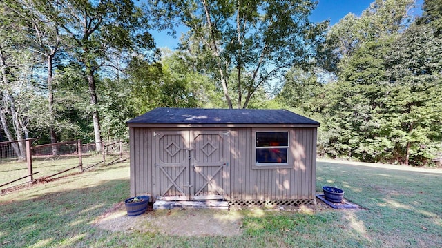 view of outdoor structure featuring a lawn