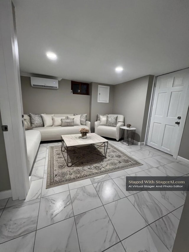 living area featuring a wall mounted air conditioner, baseboards, marble finish floor, and recessed lighting