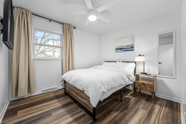 bedroom with dark wood-type flooring and ceiling fan