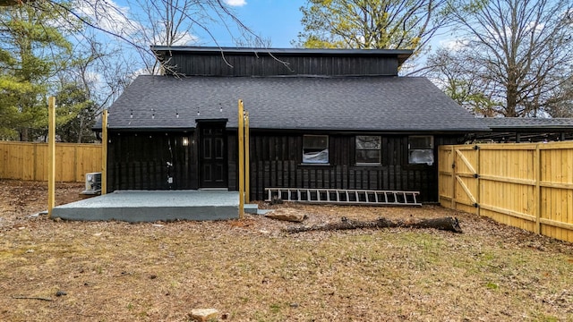 rear view of property featuring a patio area