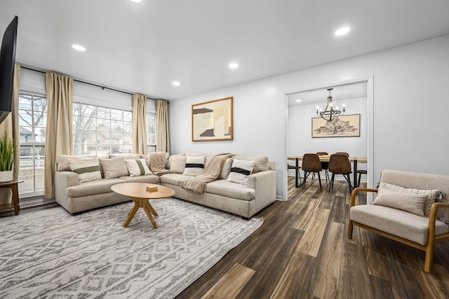 living room featuring hardwood / wood-style floors and an inviting chandelier