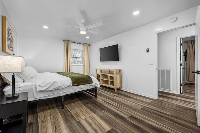 bedroom featuring dark hardwood / wood-style floors and ceiling fan