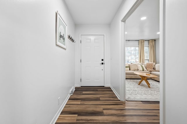 entryway with dark wood-type flooring