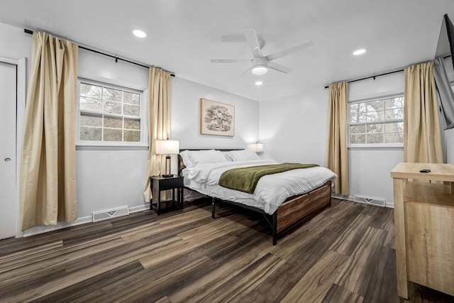 bedroom with ceiling fan and dark hardwood / wood-style floors